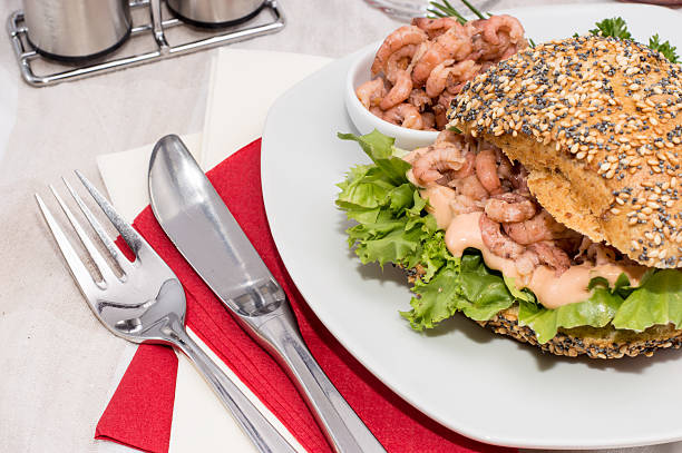 istock Roll with Shrimps on a red striped tablecloth 466960147