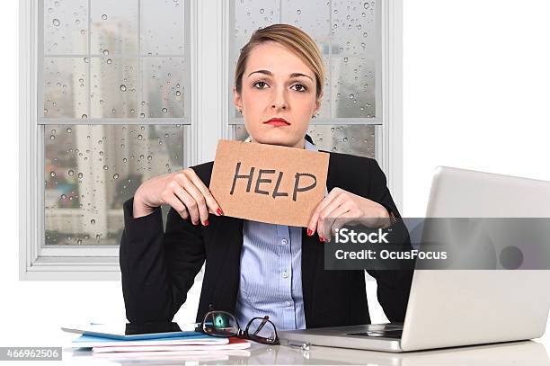 Young Stressed Businesswoman Holding Help Sign Overworked At Office Computer Stock Photo - Download Image Now