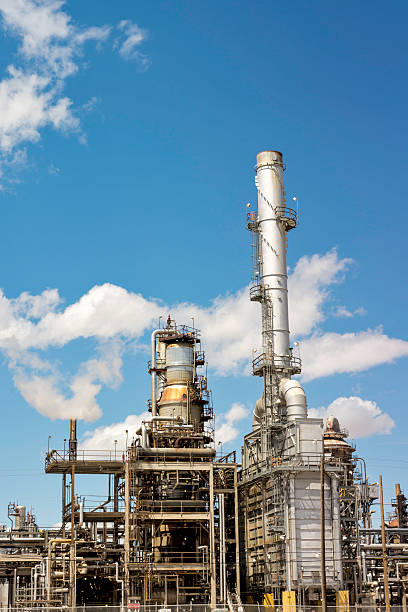 istock Smoke stacks from an oil refinery 466963306