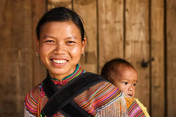 Photo of Vietnamese mother from Flower Hmong Tribe with her baby
