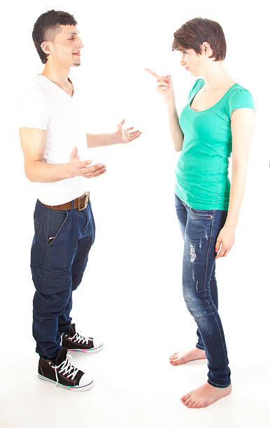 istock Young man and woman arguing isolated on white background 466967161