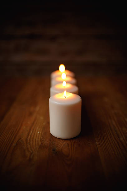 istock Candle on old wooden background 466967886