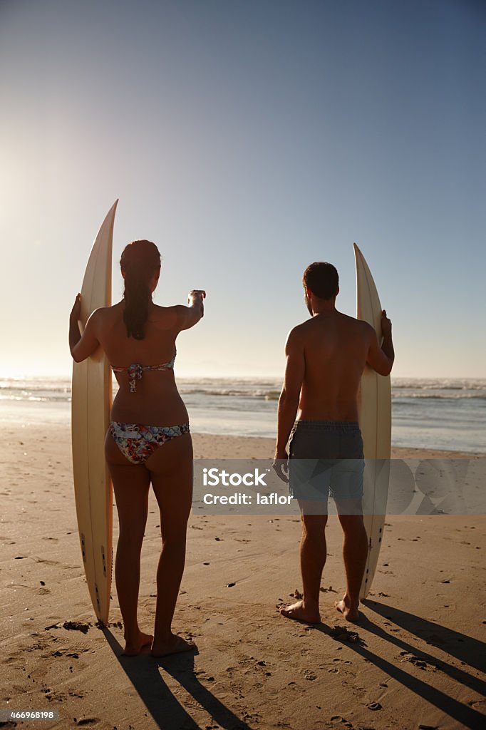 She's found the best break Rearview shot of a young surfer couple looking out at the beach and distant waveshttp://195.154.178.81/DATA/istock_collage/a4/shoots/785285.jpg 2015 Stock Photo