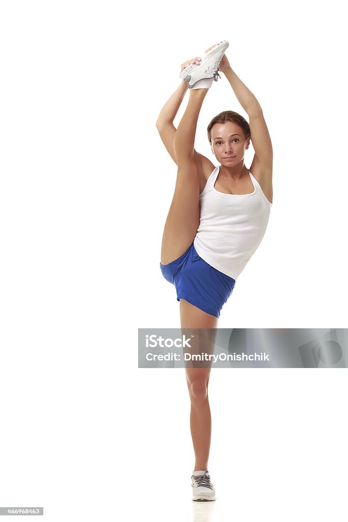 Jovem atraente mulher fitness modelo em malhas a fazer alongamentos - Royalty-free Cabelo Humano Foto de stock
