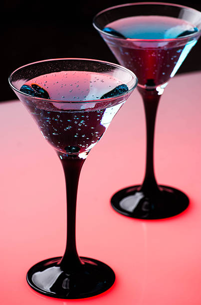 istock Blue cocktail in martini glasses on the bar table 466969332