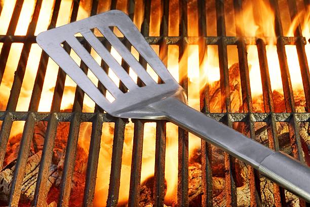 istock Spatula on the Hot Flaming Grill 466969854