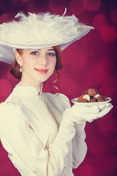 istock Beautiful redhead women with candy. 466971797