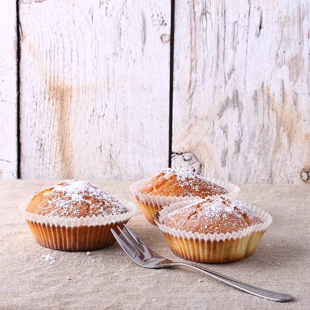 istock Delicious muffins on a wooden table 466971902
