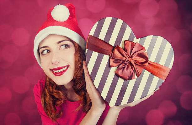 istock Redhead girl with gift 466971937