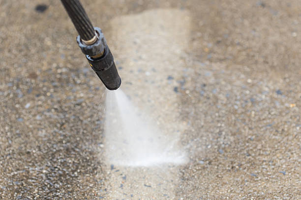 istock Outdoor floor cleaning with high pressure water jet 466972396