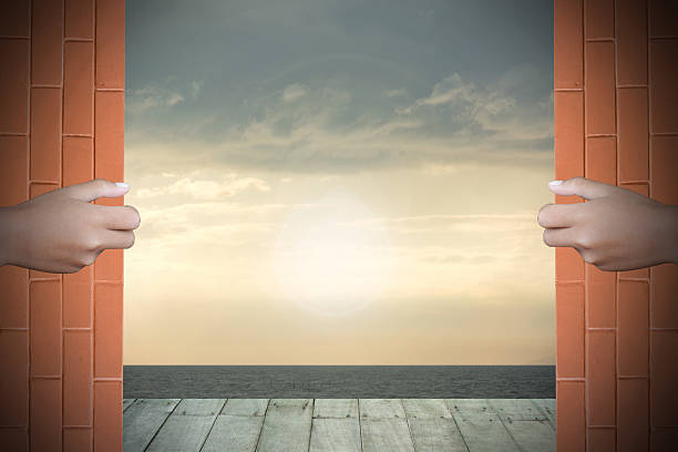 istock Two hands to open the door sea background 466972664