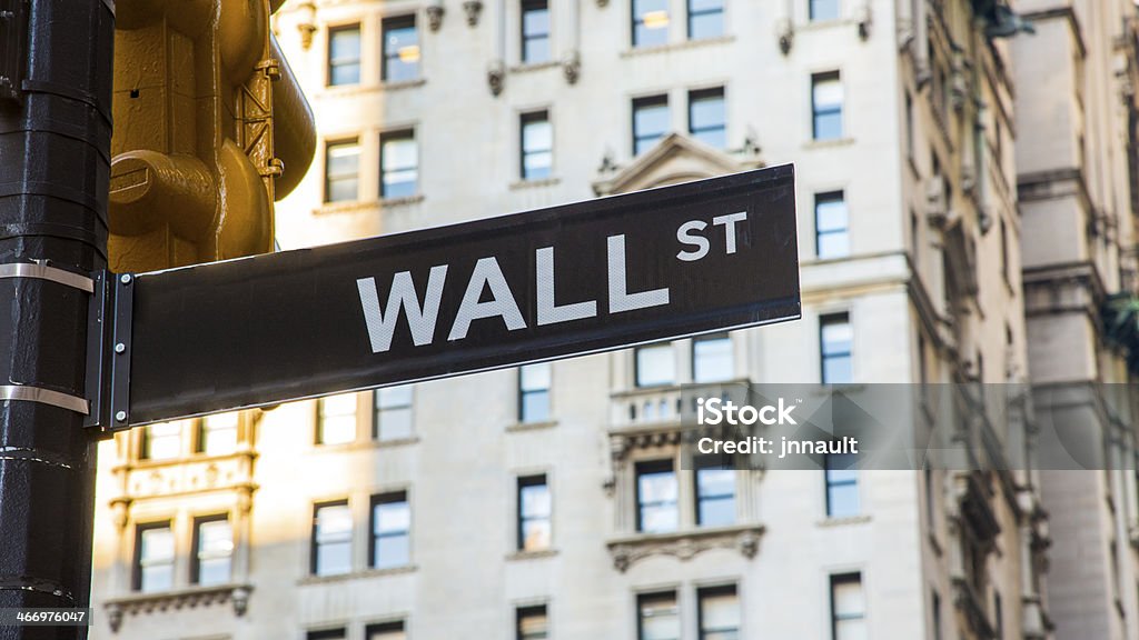 Wall Street Sign in New York USA http://i1332.photobucket.com/albums/w601/jnnault/MontageNewYork_zps4509a61a.jpg Copy Space Stock Photo