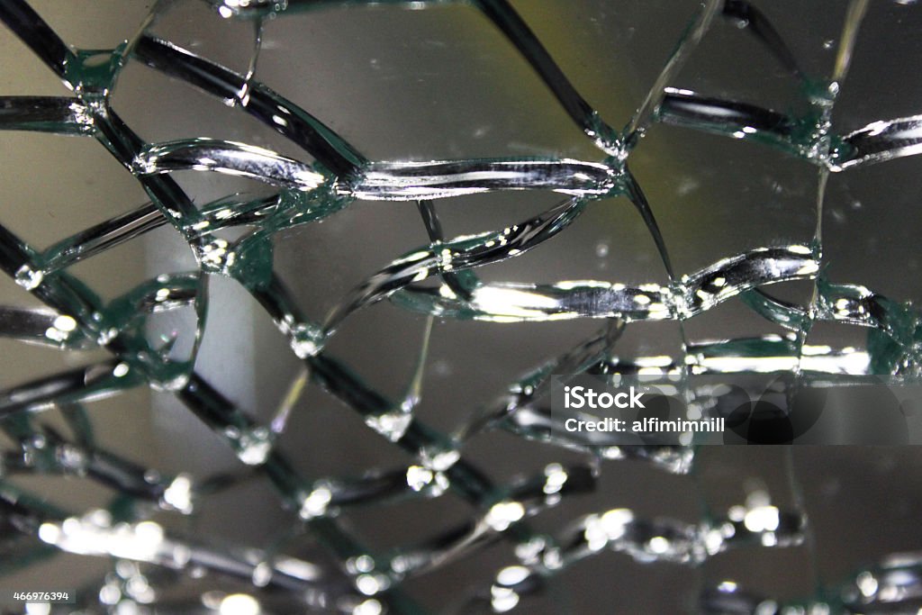 Cracked glass macro Broken glass cracked window gray color abstract background 2015 Stock Photo