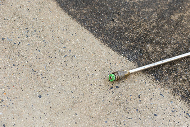 istock Outdoor floor cleaning with high pressure water jet 466976696