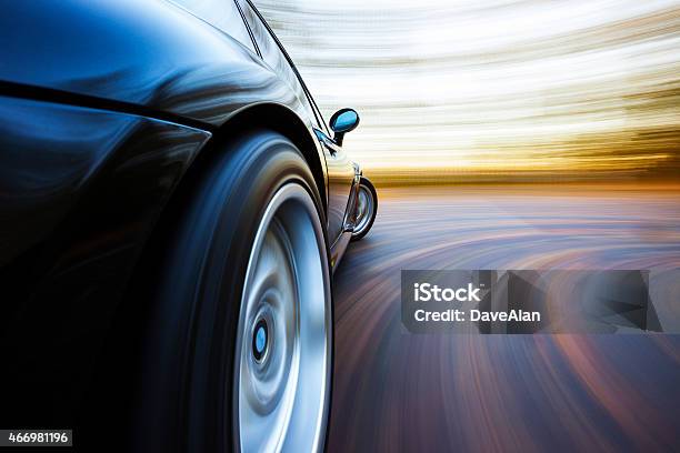 Speeding Curve Sports Car Stock Photo - Download Image Now - Car, Speed, Tire - Vehicle Part