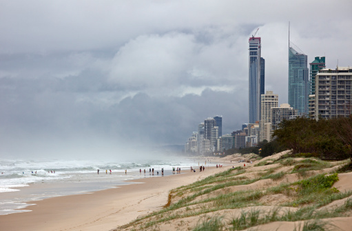 Australia - beach of Gold Coast with stormy clouds and waves