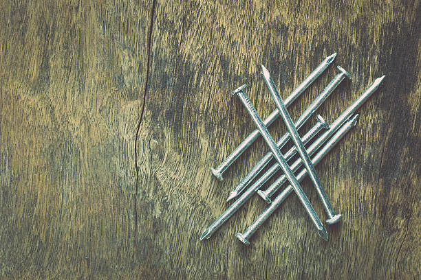 istock Metal nail on wood 466983046