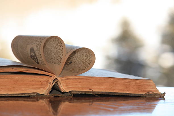 istock Pages of an old book curved into a heart shape. 466986777