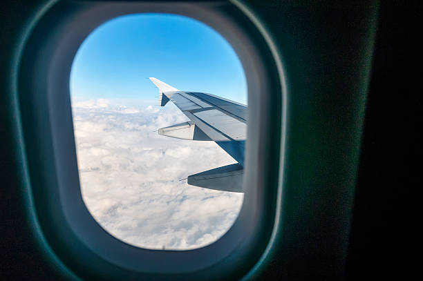 istock Looking out the window of a plane 466988622