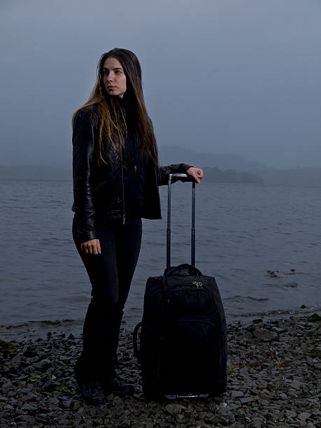 Girl with suitcase stock photo