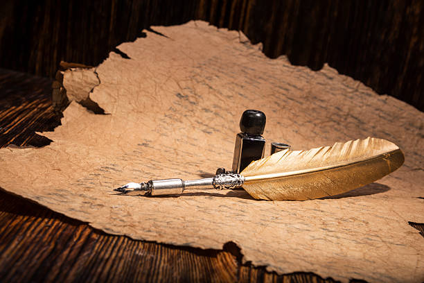 istock Vintage golden pen and ancient manuscripts 466991738