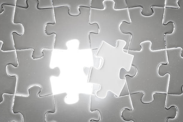 Business success, jigsaw puzzle concept lighting in studio.