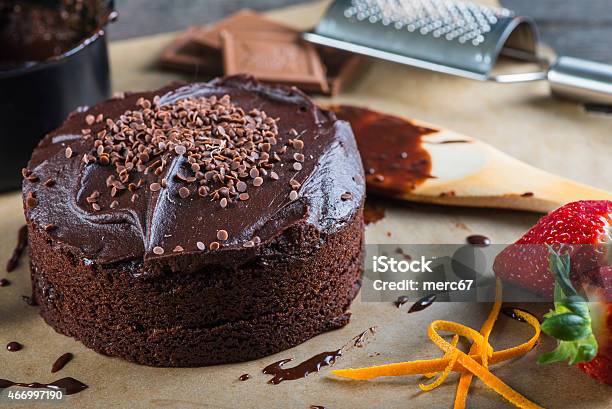 Baking And Decorating Chocolate Cake Stock Photo - Download Image Now - 2015, Backgrounds, Baked