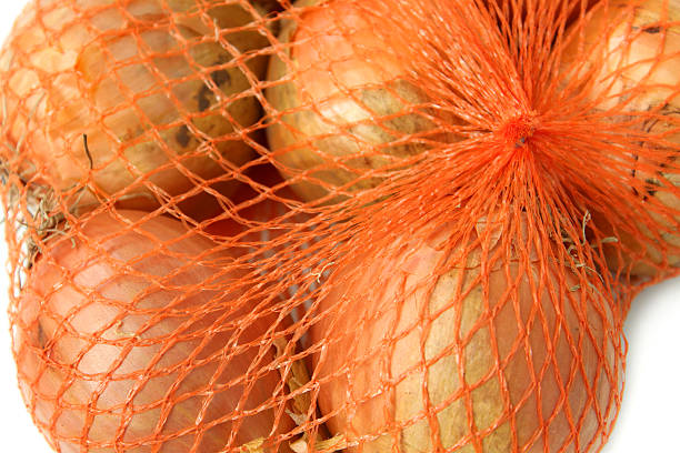 istock Image of dried white onions, white background, string-bag / net bag 466997948