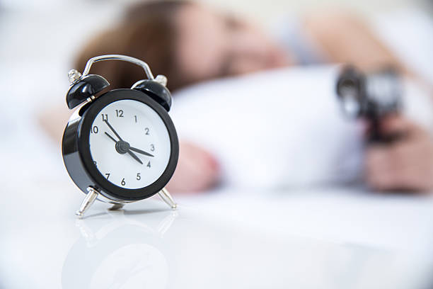 istock woman sleeping on the bed with alarm 466998340