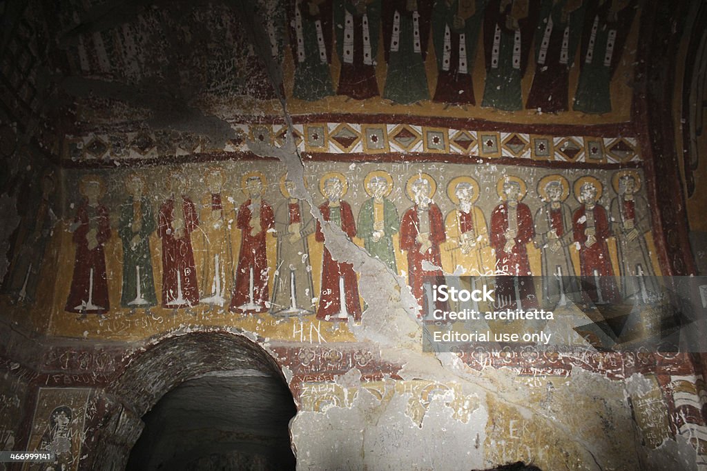 Yilanli church Aksaray, Turkey - April 21, 2012: Yilanli church interior in Ihlara valley. The church was built in 9th century. Ihlara valley holds a lot of church which are carved into the rocks. There are damaged religious frescoes on the walls. Carving - Craft Product Stock Photo