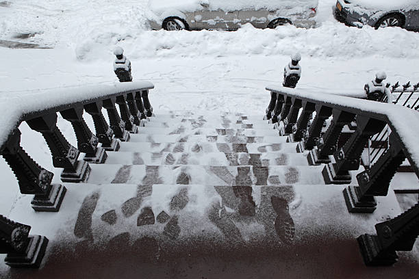 istock Footprints in snow on a  Brooklyn stoop in winter storm 467001998