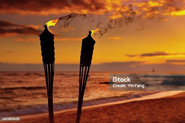 Tiki Lamps On The Beach Of Hawaii Stock Photo - Download Image Now - Beach, Tiki, Night