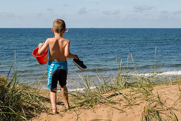 istock Boy with beach toys 467002506