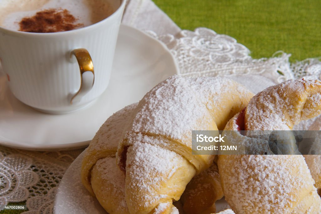 Sweet croissants Sweet croissants stuffed with raspberries and sprinkled with castor sugar 2015 Stock Photo