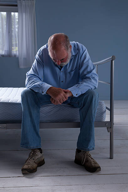 istock Lonely Man In A Bare Bedroom 467002895