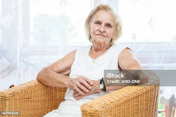 Portrait Of An Elderly Lady Sitting In A Chair Stock Photo - Download Image Now - 2015, 70-79 Years, Active Seniors