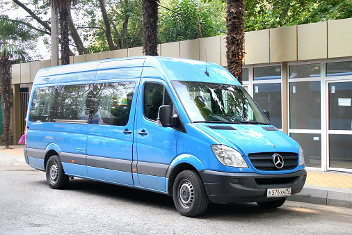 Sochi, Russia - July 25, 2009: Blue Mercedes-Benz Sprinter passenger van parked at the city street.