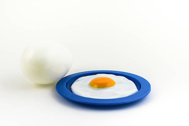 istock Sunny side up on a plate with a large egg on the side. 467005433