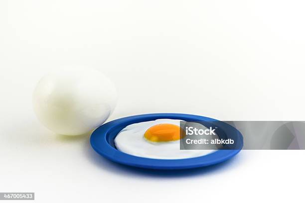 Sunny Side Up On A Plate With A Large Egg On The Side Stock Photo - Download Image Now