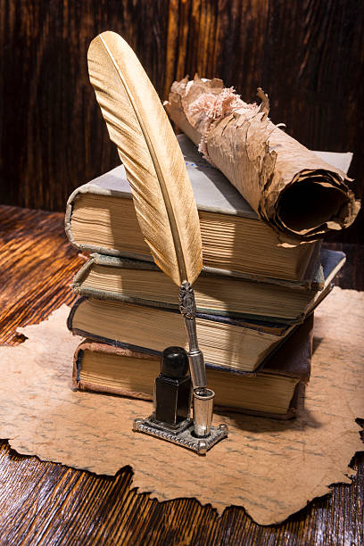 istock Vintage golden pen and ancient manuscripts 467005504