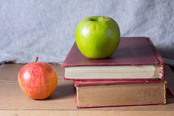 istock Apples with antique books. 467005583