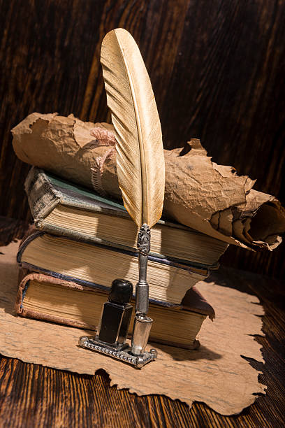 istock Vintage golden pen and ancient manuscripts 467005634