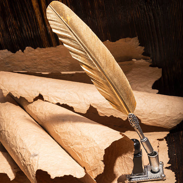 istock Vintage golden pen and ancient manuscripts 467005636