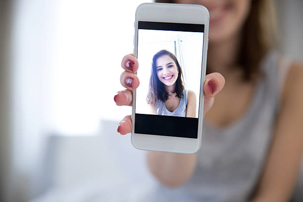 istock Cheerful woman making selfie photo 467006006