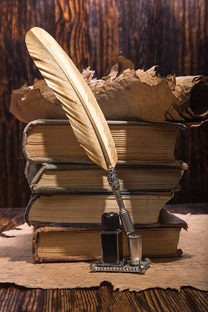 istock Vintage golden pen and ancient manuscripts 467006100