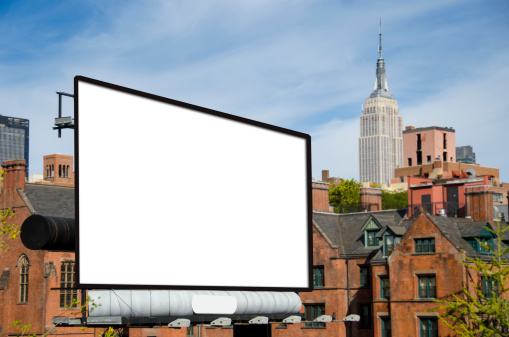 A large blank urban billboard with copy space