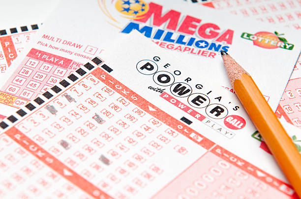 Lottery Tickets Alpharetta, GA, USA - Feruary 01, 2014 - Powerball and Mega Million lottery forms.  Both lottery's are a US multi-state lottery with prizes often reaching into hundreds of millions of dollars. georgia us state stock pictures, royalty-free photos & images