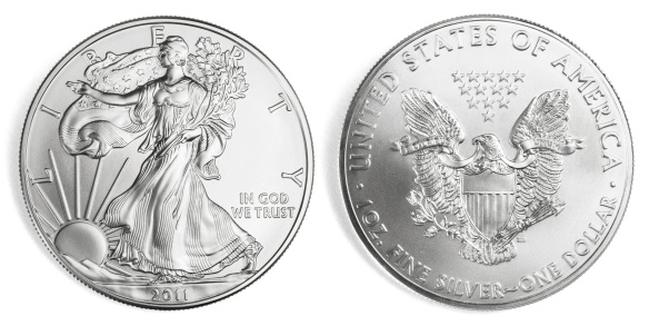 Front and back of an one ounce silver eagle coin, isolated on white background. Clipping path included.
