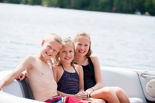 Happy girls enjoying herself at the cottage, but the water, lake or river.
