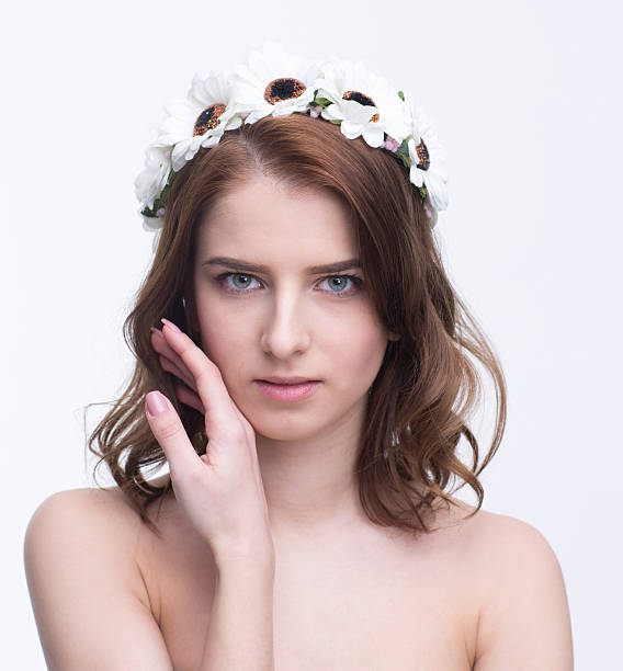 istock woman with wreath looking at camera 467011942